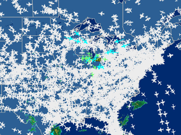 This screenshot provided by FlightAware shows airline traffic at 10:20 a.m. EDT over the United States Sept. 26, 2014, after hundreds of flights were canceled at Chicago airports, at center, following a fire at a suburban Chicago air traffic control faci 