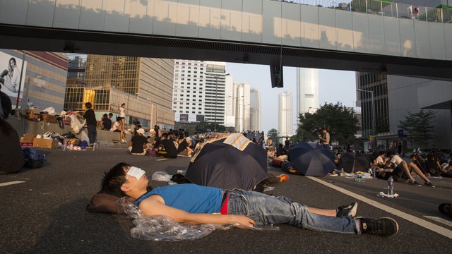 Protesters sleep on the streets outside the Hong Kong Government Complex 
