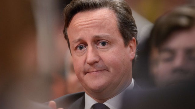 British Prime Minister David Cameron is pictured as he listens to a speech by Mayor of London Boris Johnson  