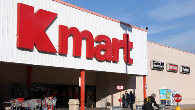 A customer leaves a Kmart store Nov. 14, 2012, in Chicago. 