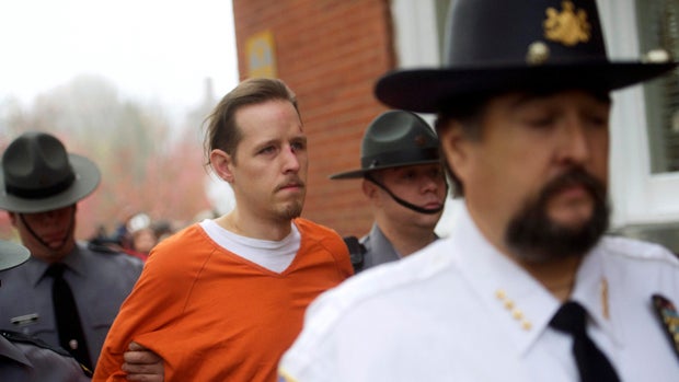 Eric Matthew Frein exits the Pike County Courthouse with police officers after an arraignment in Milford, Pennsylvania, Oct. 31, 2014. 