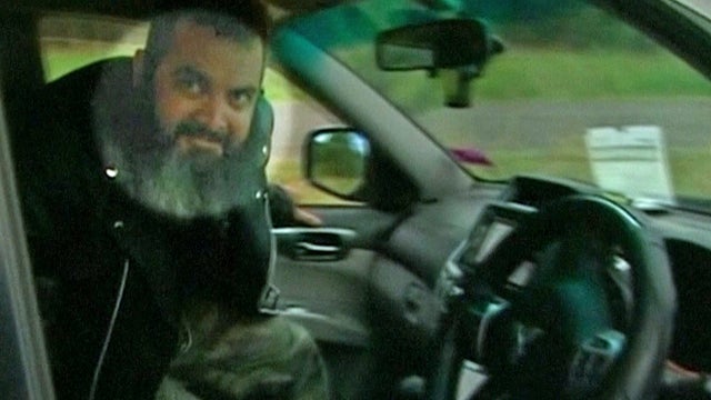 ​A suspected carjacker is seen entering a vehicle in an image taken from video shot by Australian cameraman Peter Steer 