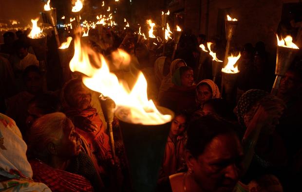 Indian victims and relatives of those killed in the Bhopal gas disaster take part in a torch-lit procession to mark the disaster's 30th anniversary in Bhopal Dec. 2, 2014. 