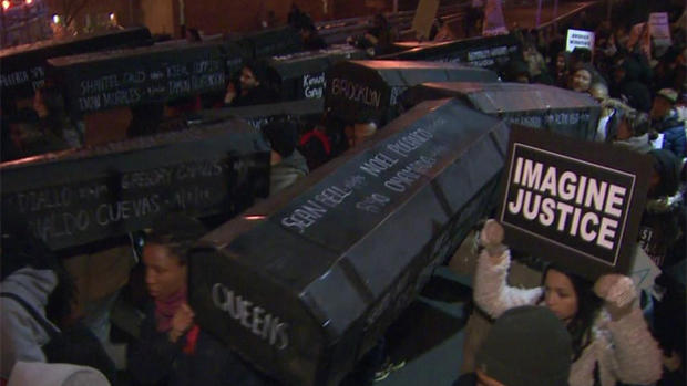 Eric Garner protesters hold makeshift coffins 