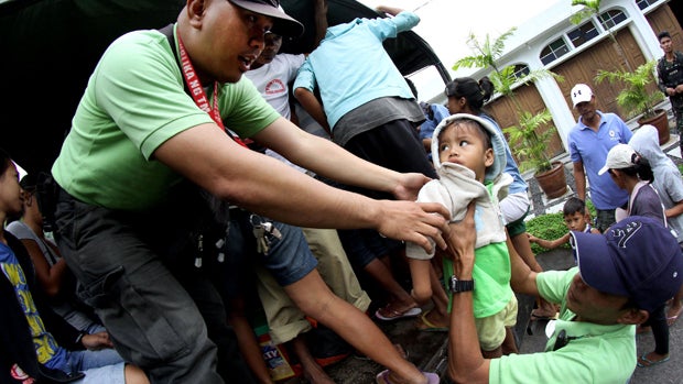 Residents are evacuated to a safer place in Legazpi City, Albay province, southeast of Manila Dec. 6, 2014, ahead of the arrival of Typhoon Hagupit. 