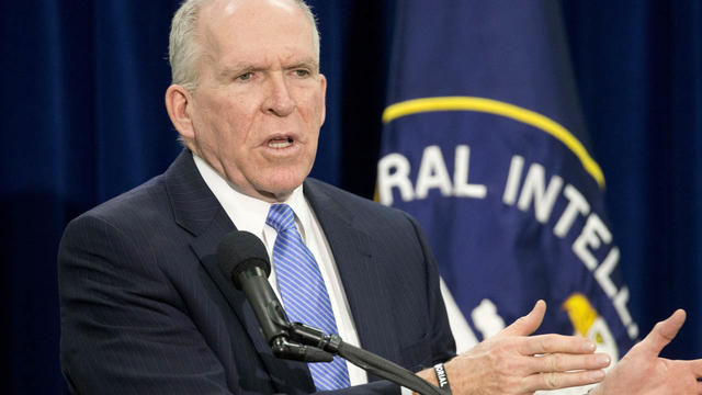 Central Intelligence Director John Brennan gestures during a news conference at CIA headquarters in Langley, Va., Dec. 11, 2014. 