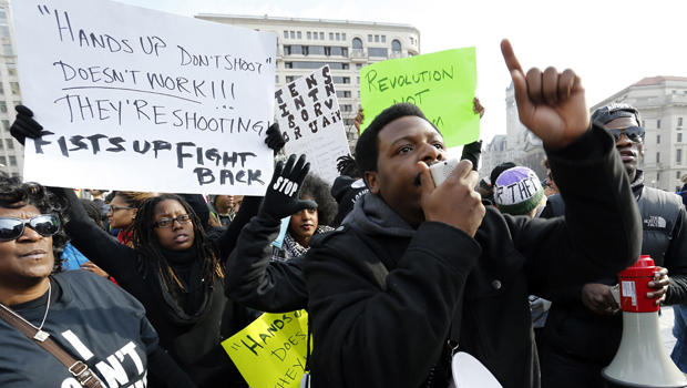 Demonstrators rally before the national Justice For All march against police violence in Washington Dec. 13, 2014. 