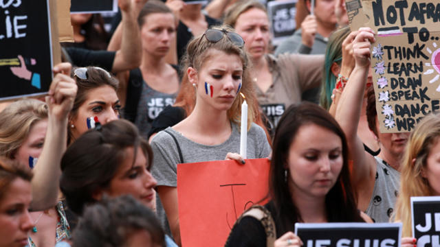 Mourners gathered during a vigil for victims of the Paris shooting massacre at Federation Square Jan. 8, 2015, in Melbourne, Australia. 