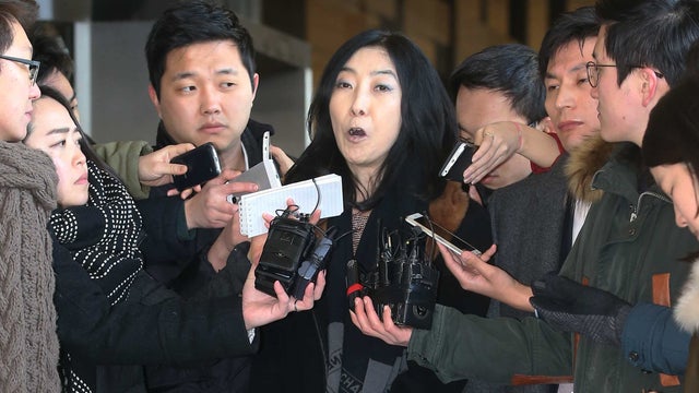 California-resident Shin Eun-mi, center, talks to reporters at Seoul District Prosecutors' Office in Seoul, South Korea. 