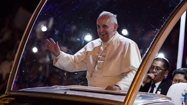 Pope Francis waves to the faithful upon his arrival in Manila, Philippines 