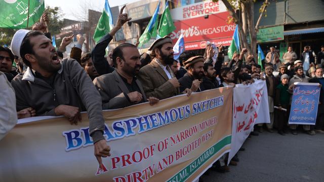 Supporters of Pakistani political and Islamic party Jammat-e-Islami (JI) chant slogans during a protest against the printing of satirical sketches of the Prophet Muhammad by French magazine Charlie Hebdo in Islamabad on Jan. 16, 2014. 