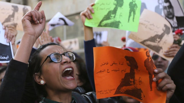 A protester chants anti-government slogans during a protest, Jan. 29, 2015, by women at the same location in central Cairo where activist Shaimaa El-Sabbagh was killed 