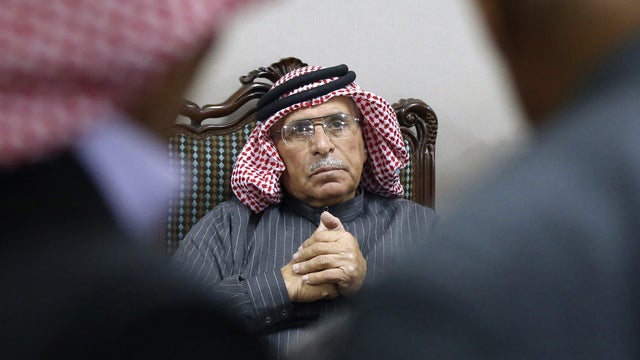 Safi Yousef (C), father of ISIS captive Jordanian pilot Muath al-Kasaesbeh, sits during a news conference in Amman 
