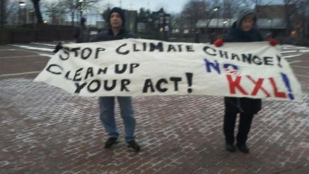 Protesters Against Keystone XL Pipeline Greet President Obama As He Comes Into Philadelphia 
