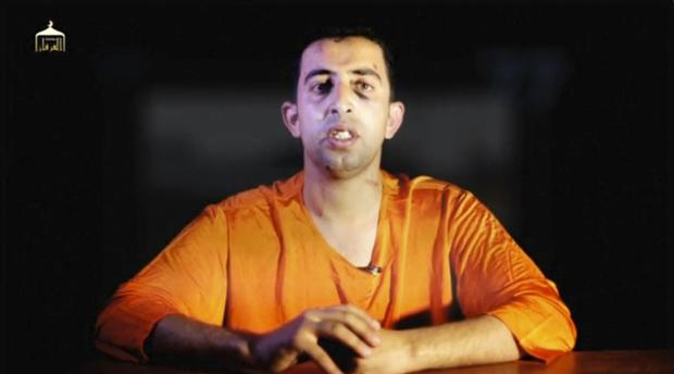 A man purported to be ISIS captive Jordanian pilot Muath al-Kasaesbeh speaks in still image from undated video filmed in undisclosed location made available on social media on February 3, 2015 