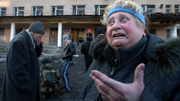 A woman reacts outside a damaged hospital in Donetsk Feb. 4, 2015, where at least two shells landed in the separatist-controlled eastern Ukrainian city. 