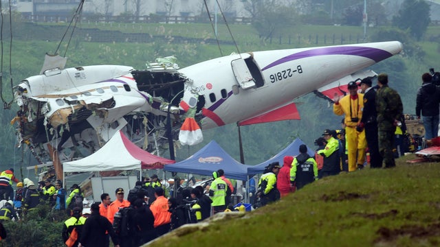 A general view shows the crashed Transasia plane wreckage being lifted in New Taipei City on Feb. 5, 2015.  