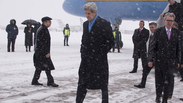 US Secretary of State John Kerry walks off the plane at Kiev Boryspil International Airport in Kiev on Feb. 5, 2015.  