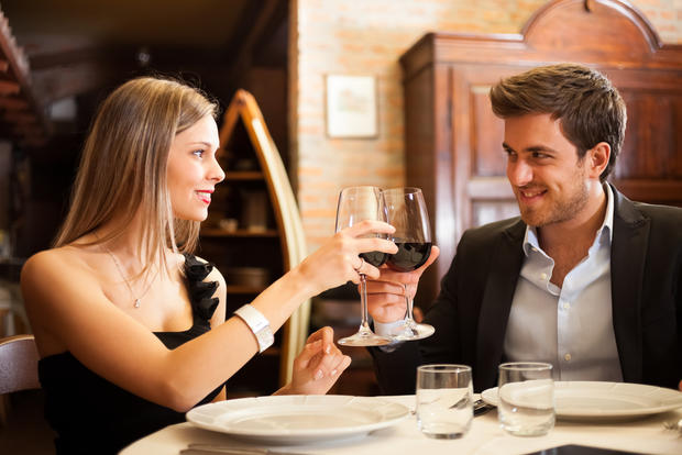 romantic dinner restaurant couple wine cheers 
