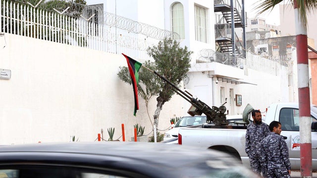 A picture taken on Feb. 15, 2015. shows security forces patrolling outside the Italian Embassy in Tripoli. 