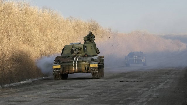A Ukrainian serviceman rides on a self-propelled howitzer near Artemivsk Feb. 19, 2015.  