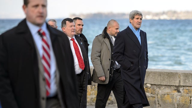 Secretary of State John Kerry  goes for a stroll with his assistant and security on the shores of Lake Geneva upon his arrival on Feb. 22, 2015 in Geneva. 