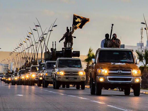 ISIS militants drive in procession through the northeastern Libyan city of Sirte 