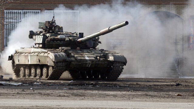 A Ukrainian army tank rides through a checkpoint near Horlivka, in the region of Donetsk, on Feb. 23, 2015.  