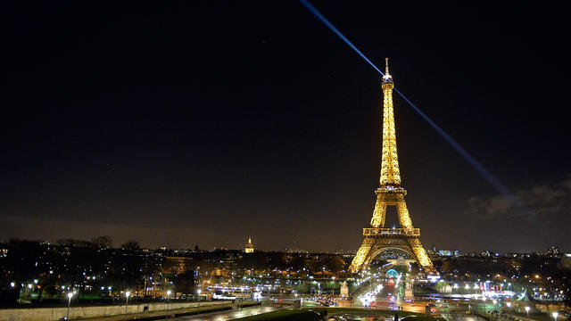 PARIS, FRANCE - As a tribute for the victims of the Charlie Hebdo terrorist attack the lights of the Eiffel Tower were turned off for five minutes at 8pm local time on Jan. 8, 2015 in Paris, France. 