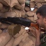 ​A Kurdish peshmerga fighter mans a position just 30 yards from ISIS-held territory in Kirkuk, Iraq 