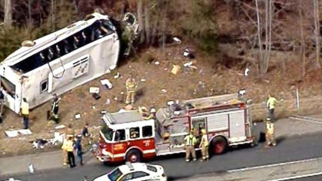 ​Crews work the scene after a bus overturned on Interstate 65 in southern Indiana March 12, 2015. 