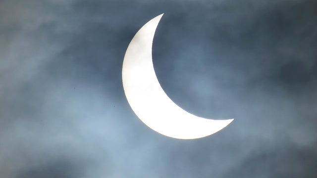 A partial solar eclipse is seen from near Bridgwater, in south western England 