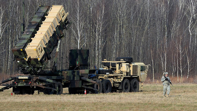 U.S. troops place a Patriot air and missile defense launching system at a test range in Sochaczew, Poland 