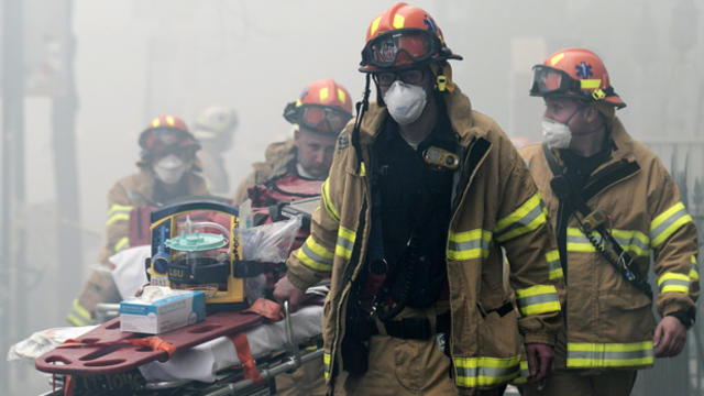 New York City Fire Department firefighters respond to a fire at the site of a residential apartment building collapse and fire in New York City's East Village neighborhood March 26, 2015. 