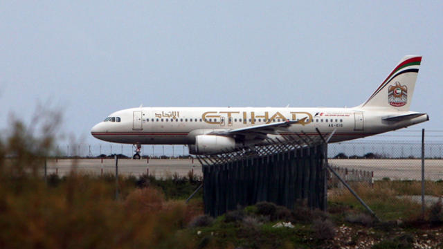 An Etihad Airways plane taxis on the runway at Larnaca airport in the Cypriot southern port city Jan. 10, 2015. 