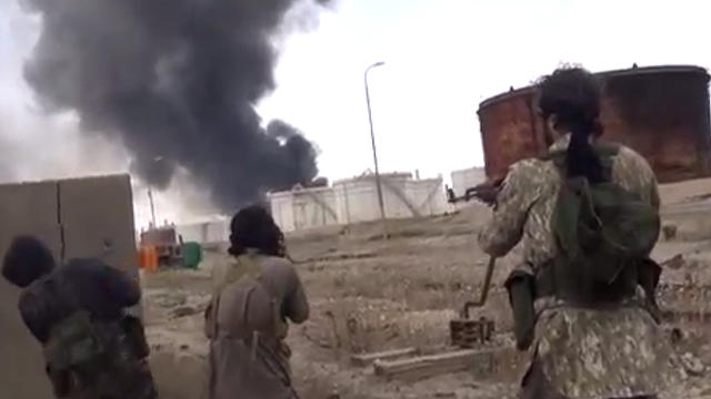 ​An image from a video released online by ISIS April 15, 2015, purportedly shows militants from the group clashing with Iraqi security forces inside the sprawling Beiji oil refinery 