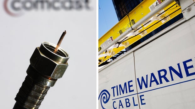 In this combination of Associated Press photos, a coaxial cable is displayed in front of the Comcast Corp. logo in Philadelphia and a Time Warner Cable truck is parked in New York. 