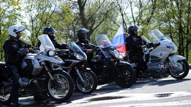 Members of the Russian Night Wolves Motorcycle Club wait at a border crossing with Poland 