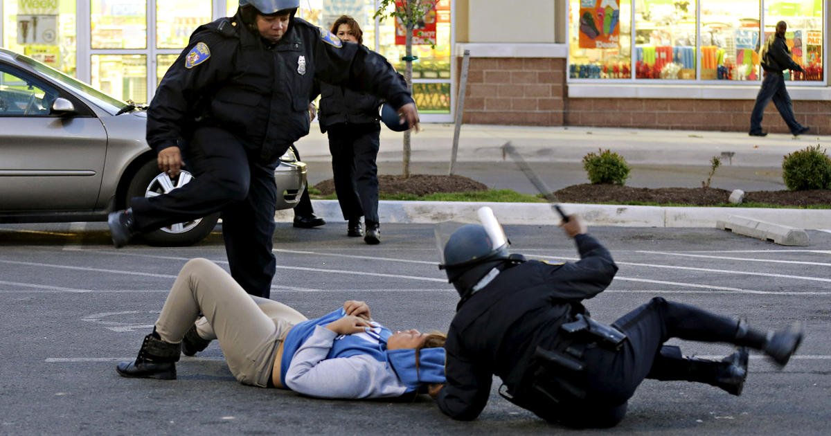 Unrest in Baltimore after Freddie Gray's death; charges filed against six police officers