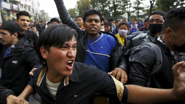 Earthquake victims chant anti-government slogans while protesting against the lack of aid for earthquake victims in Kathmandu 