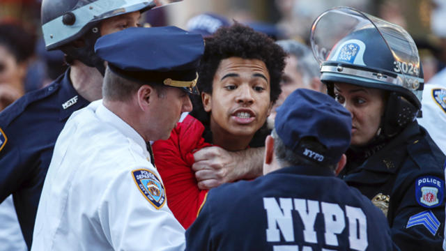 New York Police Department officers detain a protester during a march through the Manhattan borough of New York City calling for social, economic and racial justice April 29, 2015. 