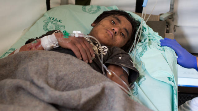 Nepalese youth Pemba Tamang,15, is treated by Israeli army medic soldiers at the Israeli field hospital following his rescue earlier in the day in Kathmandu, Nepal, April 30, 2015. 
