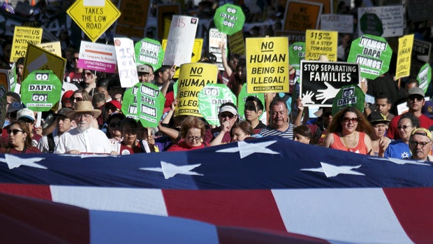 Demonstrators participate in a May Day rally in Los Angeles, California, May 1, 2015. 