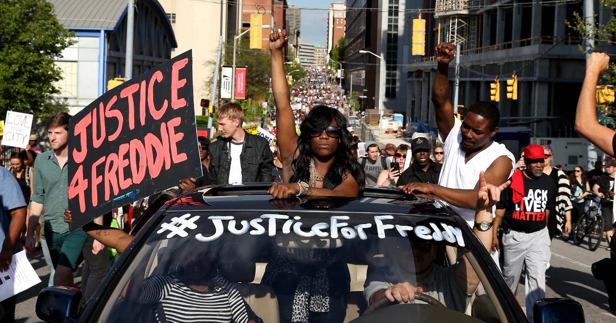 Unrest in Baltimore after Freddie Gray's death; charges filed against six police officers