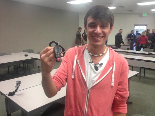 Tanner Brownlee with keys to father's patrol car 