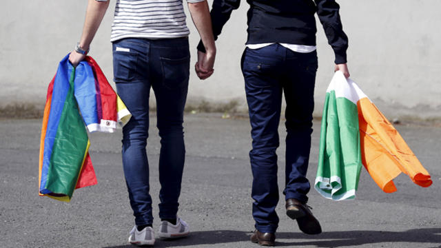 A couple walks hand in hand in Dublin as Ireland holds a referendum on same-sex marriage May 23, 2015. 