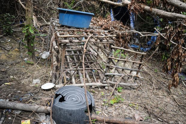 A small cage is seen at an abandoned migrant camp used by human traffickers in a jungle at Bukit Wang Burma in the Malaysian northern state of Perlis, which borders Thailand 