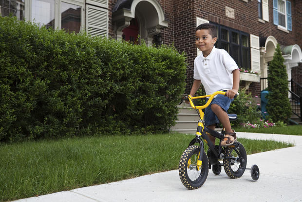 child kid bike bicycle sidewalk playing 