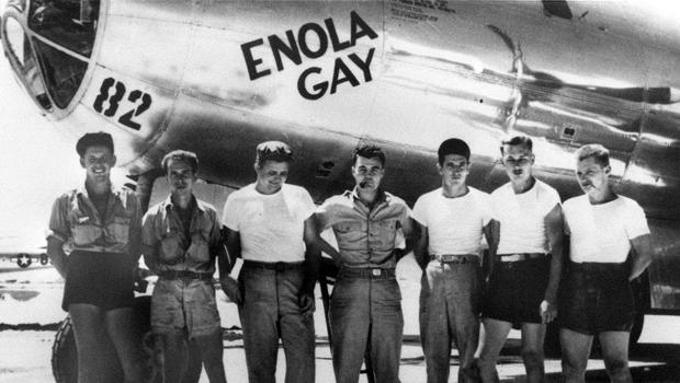 American bomber pilot Paul W. Tibbets Jr., center, stands with the ground crew of the bomber Enola Gay, which Tibbets flew in the atomic bombing of Hiroshima, Japan, in August 1945. Ground crew includes, left to right, engine mechanic Private Harold Olsen 