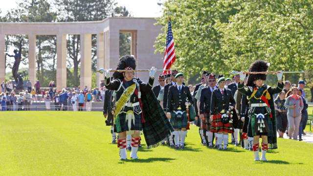 A bagpipe band performs its duties at the Colleville American military cemetery, in Colleville sur Mer, France, June 6, 2015, as part of the commemoration of the 71st anniversary of the D-Day landing. 